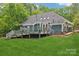 Landscaped backyard featuring a large deck, ideal for relaxing or hosting gatherings at 8338 Rittenhouse Cir, Charlotte, NC 28270
