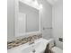 Bathroom featuring a stylish vanity and a large mirror at 8338 Rittenhouse Cir, Charlotte, NC 28270