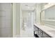 Modern bathroom with a double vanity, tiled shower, and white tiled floors at 8338 Rittenhouse Cir, Charlotte, NC 28270