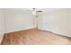 Bedroom featuring wood flooring, a ceiling fan, closet and door at 8338 Rittenhouse Cir, Charlotte, NC 28270