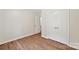 Bedroom with hardwood floors, closet and neutral walls at 8338 Rittenhouse Cir, Charlotte, NC 28270