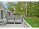 Spacious deck nestled into a beautiful yard and wooded neighborhood at 8338 Rittenhouse Cir, Charlotte, NC 28270
