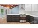 Modern kitchen featuring stainless steel appliances, sleek countertops, and wood flooring at 8338 Rittenhouse Cir, Charlotte, NC 28270