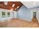 Living area with wood-paneled ceiling, skylights, and french doors at 8338 Rittenhouse Cir, Charlotte, NC 28270