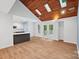 Spacious living area featuring skylights and hardwood floors at 8338 Rittenhouse Cir, Charlotte, NC 28270