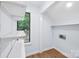 Bright utility room with window, shelving and hookups at 8338 Rittenhouse Cir, Charlotte, NC 28270