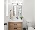 Bathroom with a modern vanity, a sleek black faucet, and a minimalist design at 9004 Lauriston Pl, Mint Hill, NC 28227
