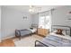 Bright bedroom featuring two twin beds, a fluffy white rug, and a window with natural light at 9004 Lauriston Pl, Mint Hill, NC 28227