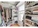 Organized walk-in closet with built-in shelving, ample storage space, and a window at 9004 Lauriston Pl, Mint Hill, NC 28227