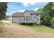 Exterior view of home featuring a large deck and backyard with mature trees at 9004 Lauriston Pl, Mint Hill, NC 28227