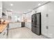 Bright modern kitchen featuring stainless steel appliances and white cabinetry and light wood counters at 9004 Lauriston Pl, Mint Hill, NC 28227