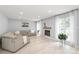 Open living room featuring neutral colors, wood flooring and fireplace at 9004 Lauriston Pl, Mint Hill, NC 28227