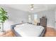 Bright main bedroom features hardwood floors, neutral walls, and a king-size platform bed at 9004 Lauriston Pl, Mint Hill, NC 28227