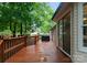 Backyard deck featuring wood railings and sliding glass doors for easy indoor-outdoor living at 901 Brighton Dr, Kannapolis, NC 28081