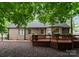 Large brick home with a spacious backyard featuring a wood deck and fenced-in yard at 901 Brighton Dr, Kannapolis, NC 28081