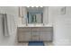 Bathroom featuring a double vanity with plenty of storage and a large mirror at 901 Brighton Dr, Kannapolis, NC 28081