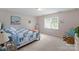 Comfortable bedroom showcasing a bed, window with blinds, and neutral decor at 901 Brighton Dr, Kannapolis, NC 28081