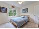 Cozy bedroom with a window, blue bedding, and neutral paint at 901 Brighton Dr, Kannapolis, NC 28081