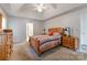 Neutral bedroom with vaulted ceilings, wood furniture, ceiling fan and carpeted floors at 901 Brighton Dr, Kannapolis, NC 28081