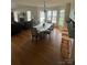 Bright dining room with hardwood floors, ample windows, and an elegant chandelier for Gathering meals at 901 Brighton Dr, Kannapolis, NC 28081