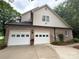 Spacious two-car garage featuring white doors and a brick exterior, offering ample parking and storage at 901 Brighton Dr, Kannapolis, NC 28081