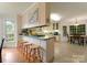 Spacious kitchen with updated countertops, a breakfast bar and an eat-in kitchen and dining space at 901 Brighton Dr, Kannapolis, NC 28081