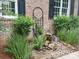 Landscaped garden featuring lush greenery, a decorative fountain, and a stone mulch bed enhancing the curb appeal at 901 Brighton Dr, Kannapolis, NC 28081