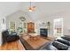 Spacious living room featuring hardwood floors, vaulted ceilings, fireplace, and plenty of natural light at 901 Brighton Dr, Kannapolis, NC 28081