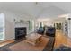 Open concept living room featuring hardwood floors, vaulted ceilings, fireplace, and an open floor plan at 901 Brighton Dr, Kannapolis, NC 28081