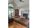 Comfortable living room featuring a fireplace, wood floors, and a decorative area rug at 901 Brighton Dr, Kannapolis, NC 28081