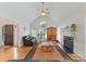 Inviting living room with vaulted ceilings, hardwood floors, fireplace, and an abundance of natural light at 901 Brighton Dr, Kannapolis, NC 28081