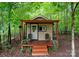 Charming backyard outbuilding with a small porch, providing a secluded retreat at 901 Brighton Dr, Kannapolis, NC 28081