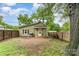 This fenced backyard includes a grill and an outdoor seating area at 910 W A St, Kannapolis, NC 28081