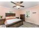Inviting main bedroom featuring a comfortable bed, warm colors, and natural light from the window at 910 W A St, Kannapolis, NC 28081