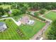 Beautiful aerial view of landscaped home with manicured lawn, backyard in-ground pool and patio at 9125 Dylan Ridge Ct, Concord, NC 28027