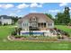 Aerial view of home highlighting the backyard in-ground pool, large yard, and outdoor living spaces at 9125 Dylan Ridge Ct, Concord, NC 28027
