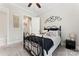 Cozy bedroom offers neutral walls, carpet, and a ceiling fan at 9125 Dylan Ridge Ct, Concord, NC 28027