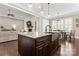 Kitchen island with granite countertop and farmhouse sink at 9125 Dylan Ridge Ct, Concord, NC 28027