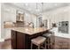 Spacious kitchen boasts a large island, stainless steel appliances, and custom cabinetry at 9125 Dylan Ridge Ct, Concord, NC 28027