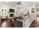 Cozy living room with a fireplace, hardwood floors, and a comfortable sofa at 9125 Dylan Ridge Ct, Concord, NC 28027