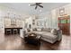Open concept living room and kitchen with modern finishes and hardwood floors at 9125 Dylan Ridge Ct, Concord, NC 28027