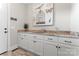 Mudroom boasts shaker cabinets, granite countertops, and a utility sink at 9125 Dylan Ridge Ct, Concord, NC 28027