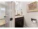 Convenient powder room features a granite countertop and bronze fixtures at 9125 Dylan Ridge Ct, Concord, NC 28027