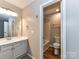 Cozy bathroom with a single sink vanity and a combined tub and shower at 9530 Elizabeth Townes Ln, Charlotte, NC 28277