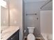 Neutral bathroom with a modern vanity and white tiled shower-tub combo at 9530 Elizabeth Townes Ln, Charlotte, NC 28277