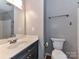 Neutral bathroom with modern fixtures and a combined shower-tub with tile at 9530 Elizabeth Townes Ln, Charlotte, NC 28277