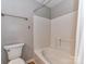 Clean bathroom featuring a white tiled shower-tub combo and modern fixtures at 9530 Elizabeth Townes Ln, Charlotte, NC 28277