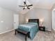 Cozy bedroom featuring a vaulted ceiling with a fan, carpeted floor and gray accent bench at 9530 Elizabeth Townes Ln, Charlotte, NC 28277