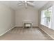 Bright bedroom with vaulted ceilings, a decorative vanity, and ample natural light at 9530 Elizabeth Townes Ln, Charlotte, NC 28277