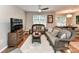 Inviting living room featuring cozy seating, a ceiling fan, and wood-look flooring at 9530 Elizabeth Townes Ln, Charlotte, NC 28277